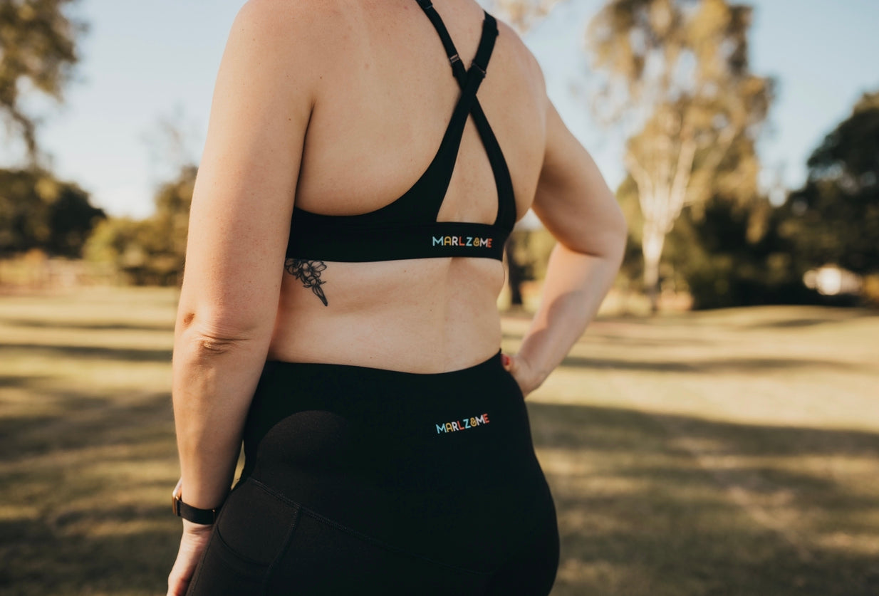 Close up detail of the Classic Black Cross Sports Bra from the back