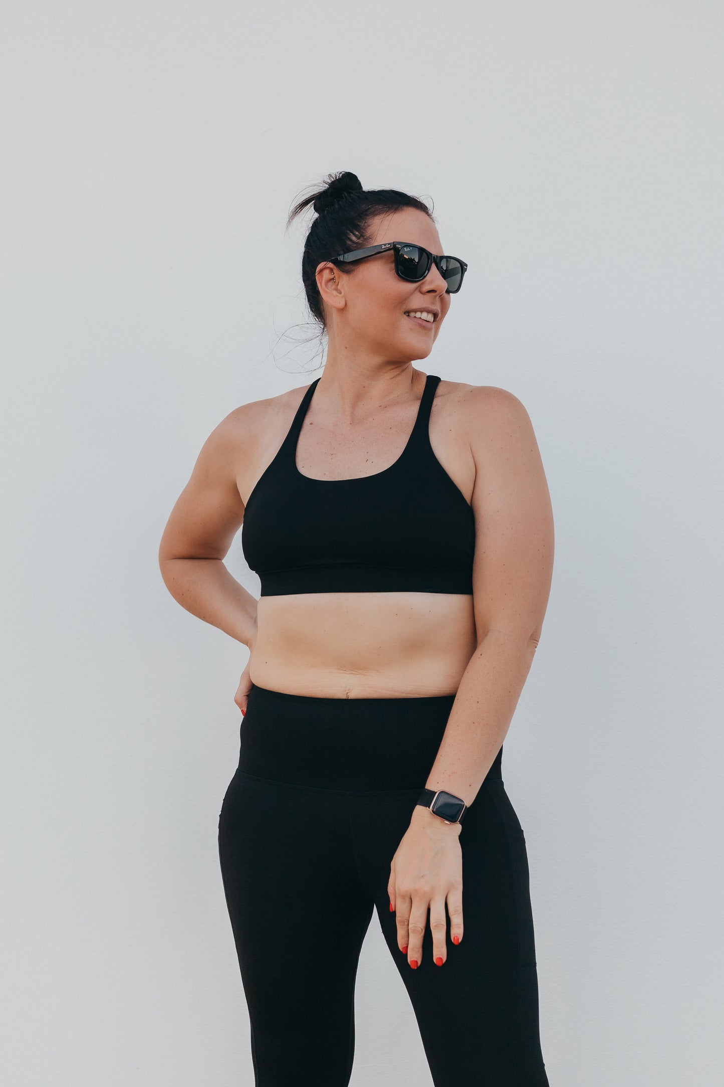 Women at the beach wearing the marlz and me Classic Black Cross Sports Bra and Classic Black Full Length Tights.